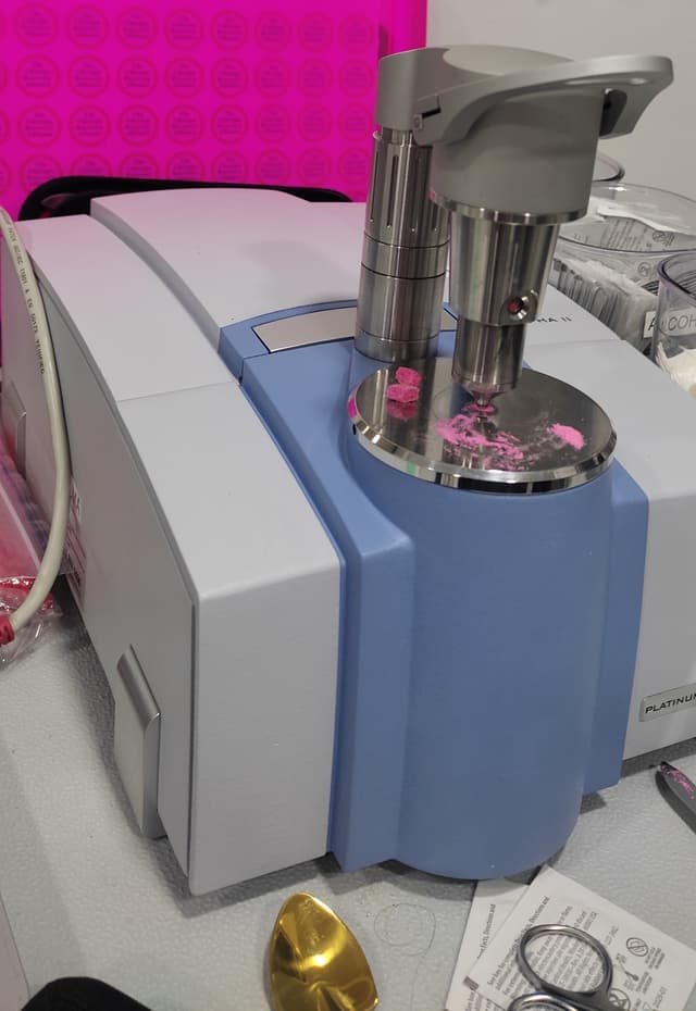 FTIR machine testing a sample of pink tusi powder.
